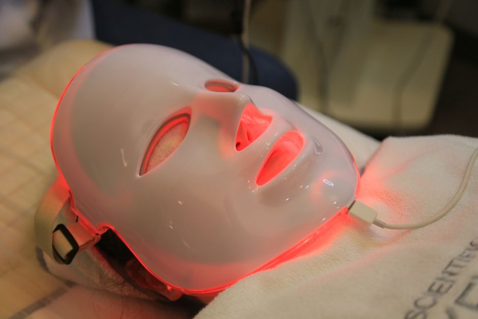 Flexible LED light therapy mask on a vanity table