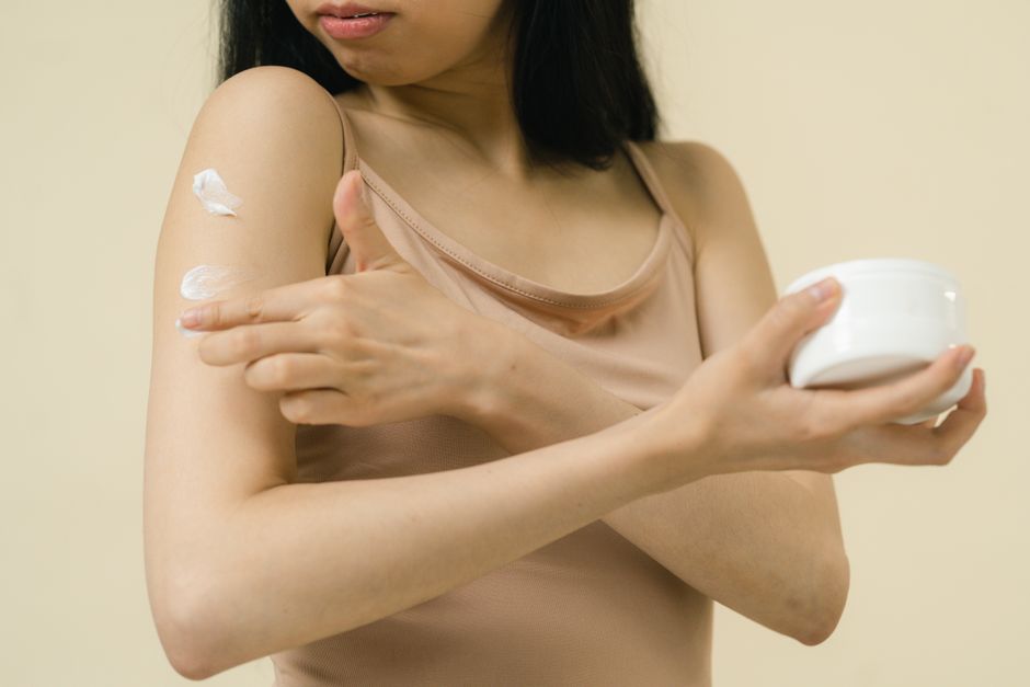 IPL hair removal session on the arm with cooling device